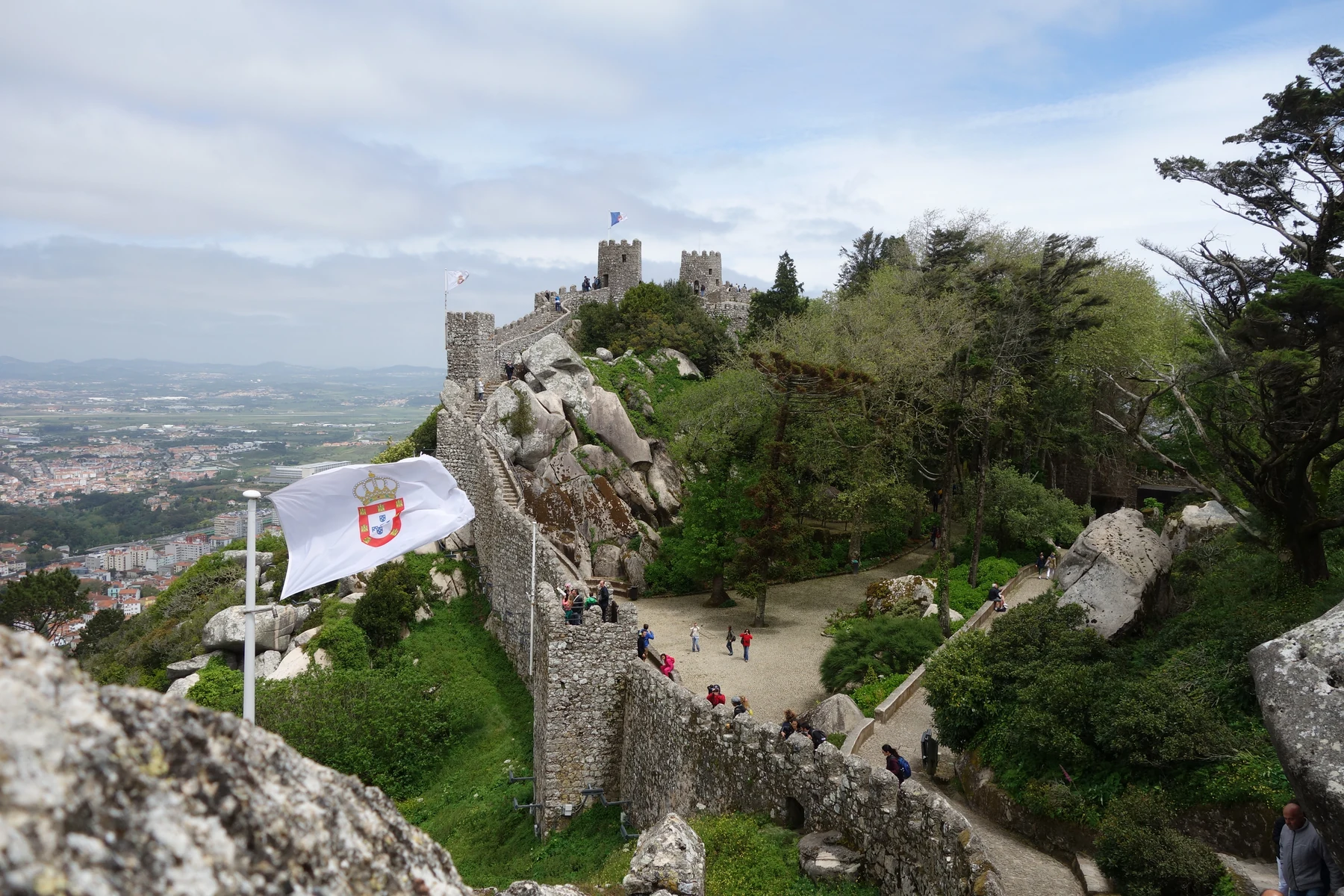 The winding stone walls and towers of the Moorish Castle above Sintra